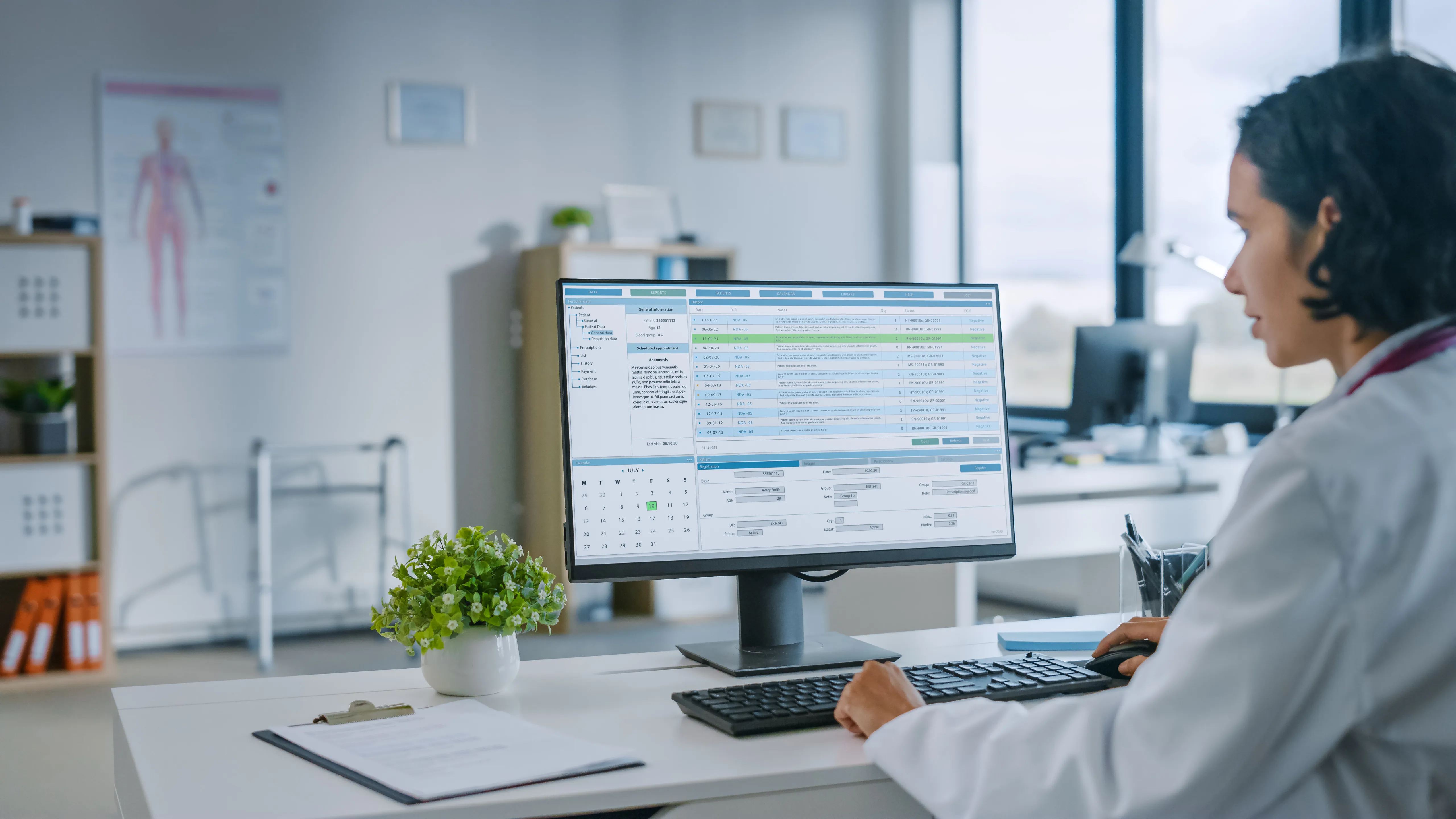 An analyst working across several monitors