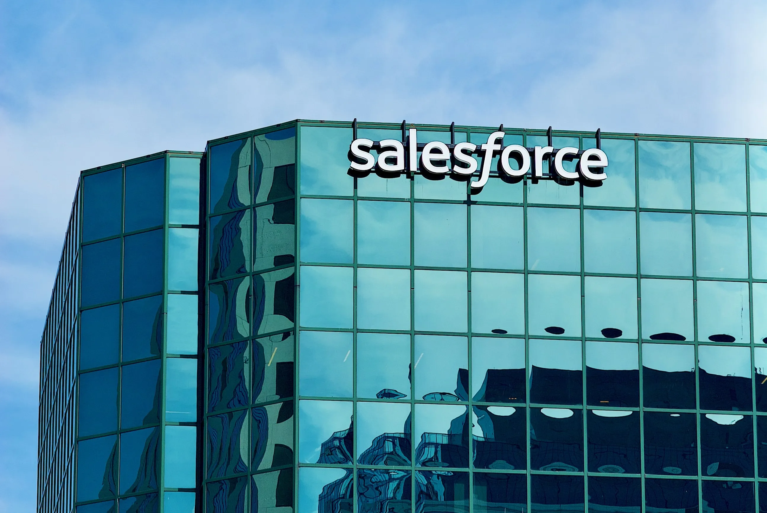 A Salesforce office tower against a blue sky