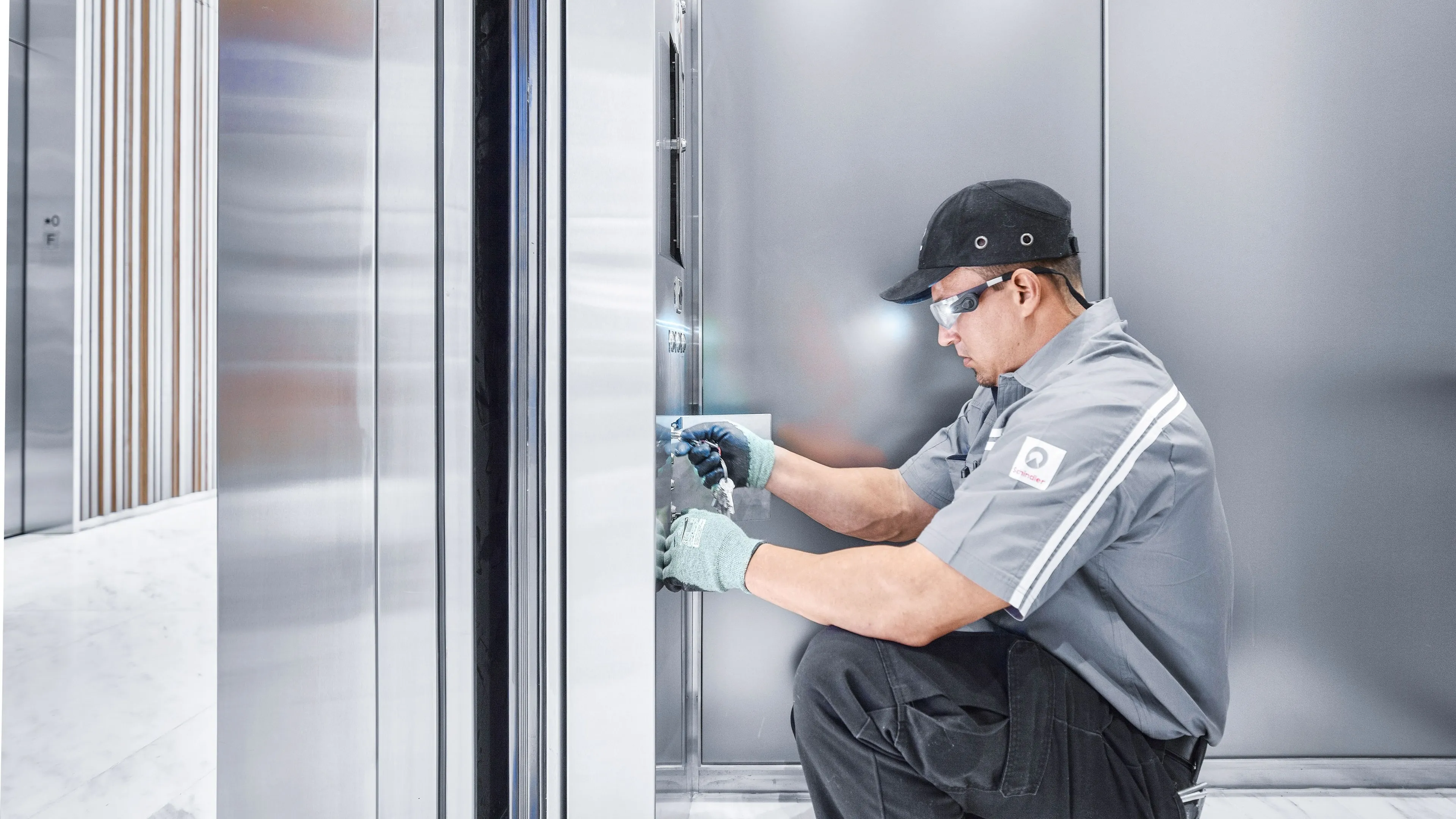 A Schindler technician servicing an elevator