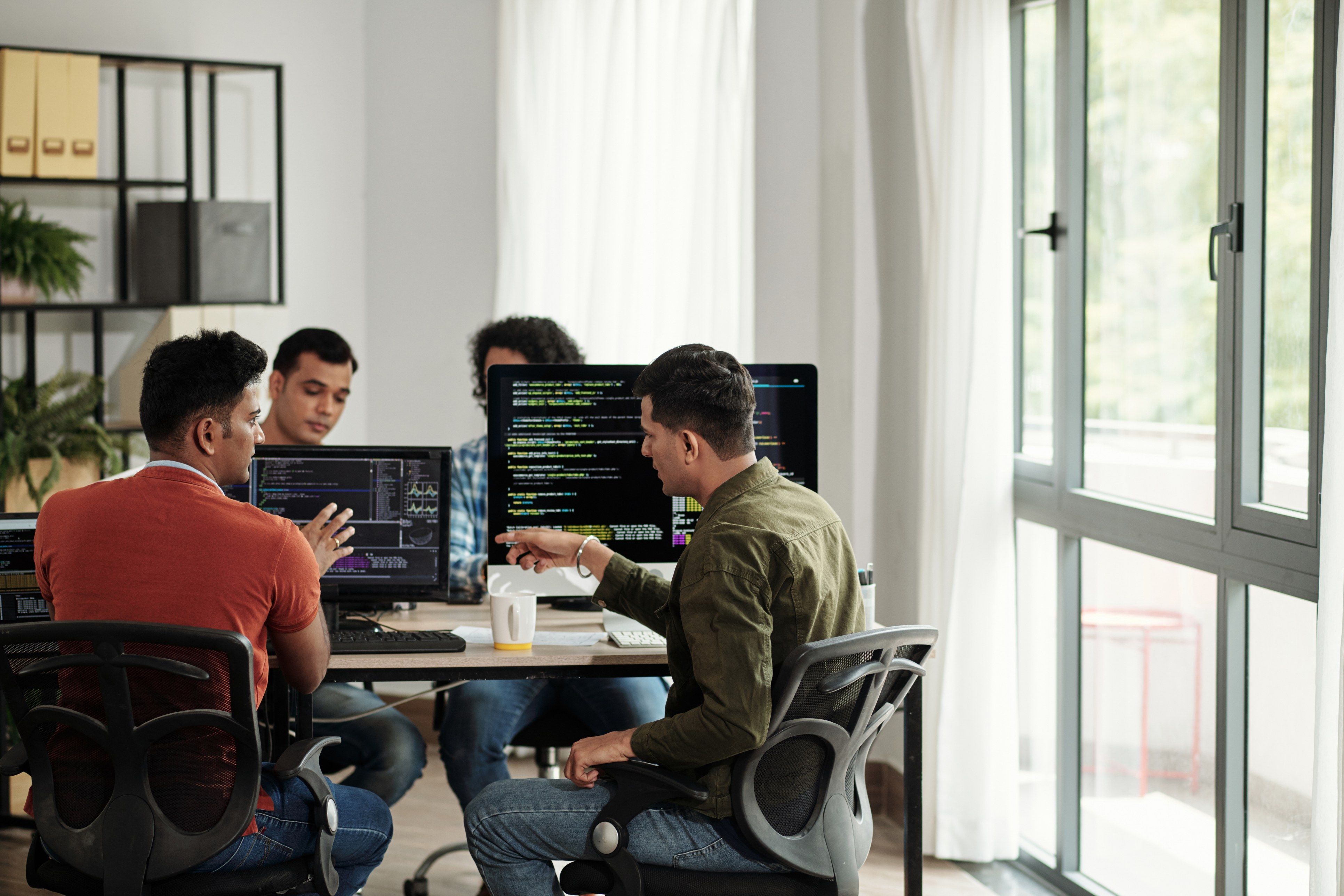 Engineers working together at a desk