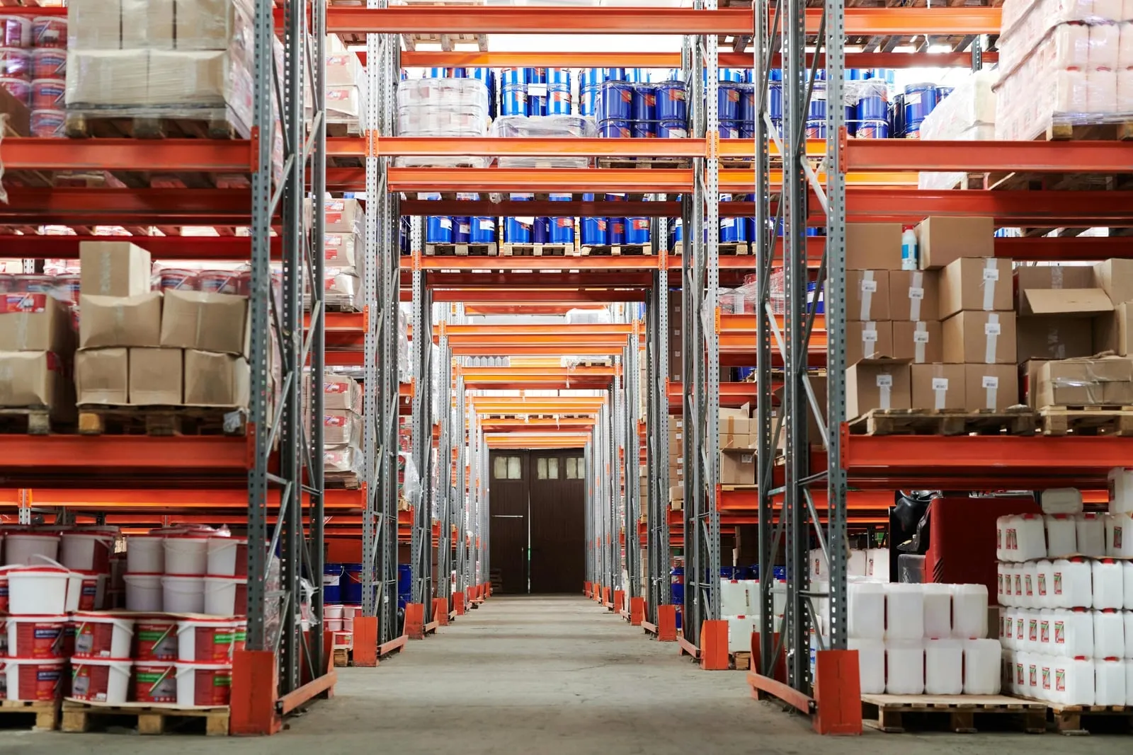 A warehouse aisle lined with stocked pallet racks