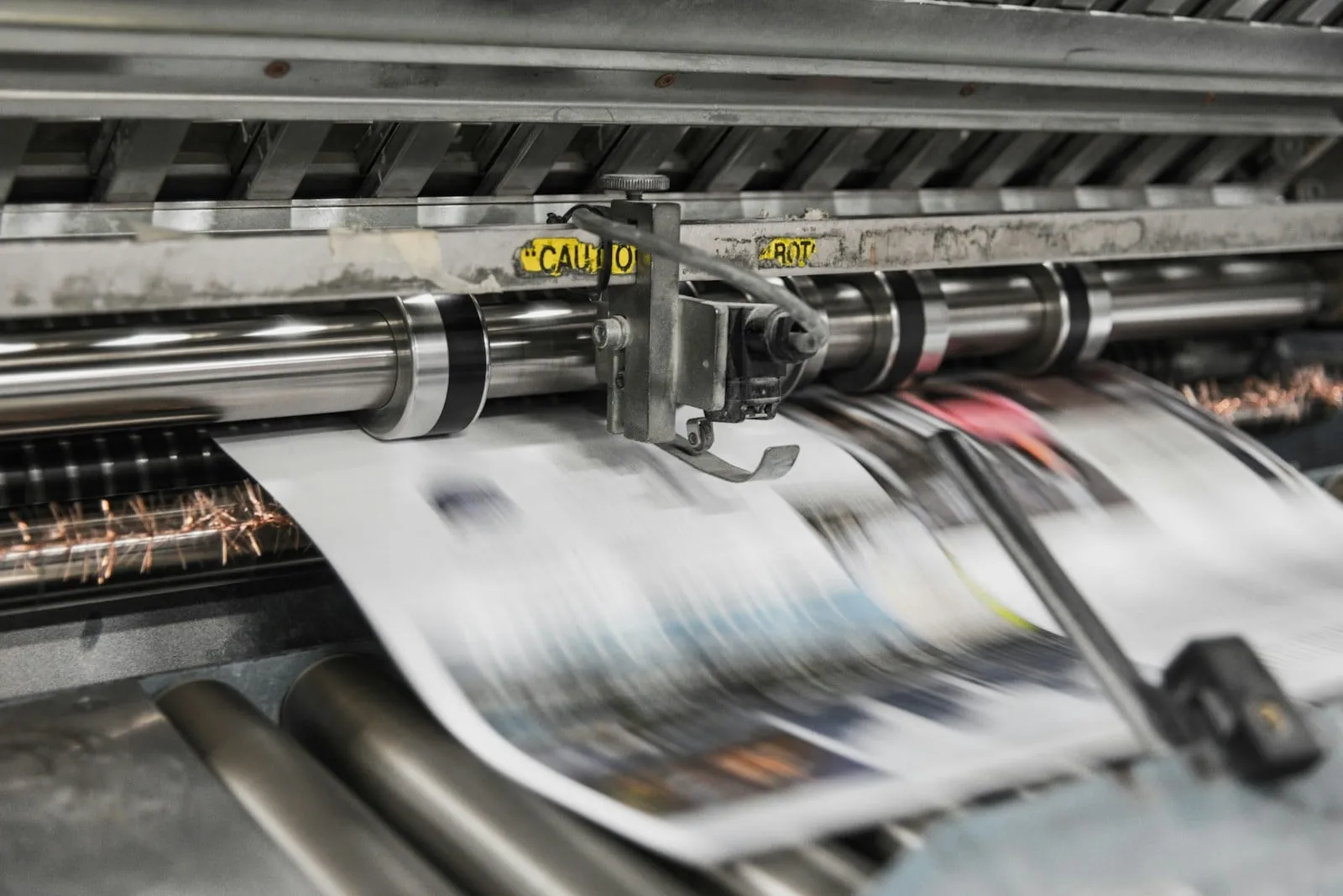 A printing press running printed sheets