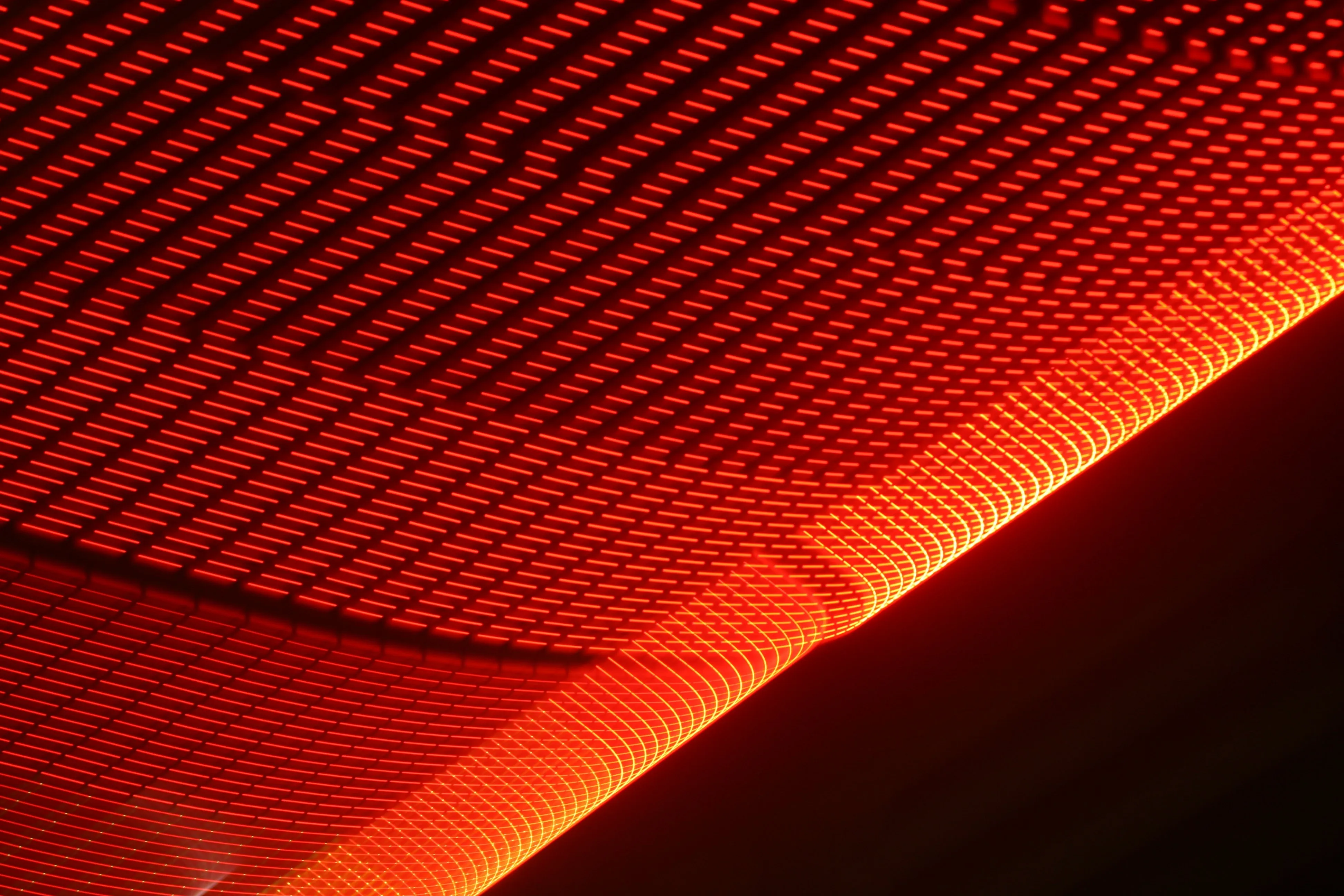 Rows of red and orange light glowing in the dark
