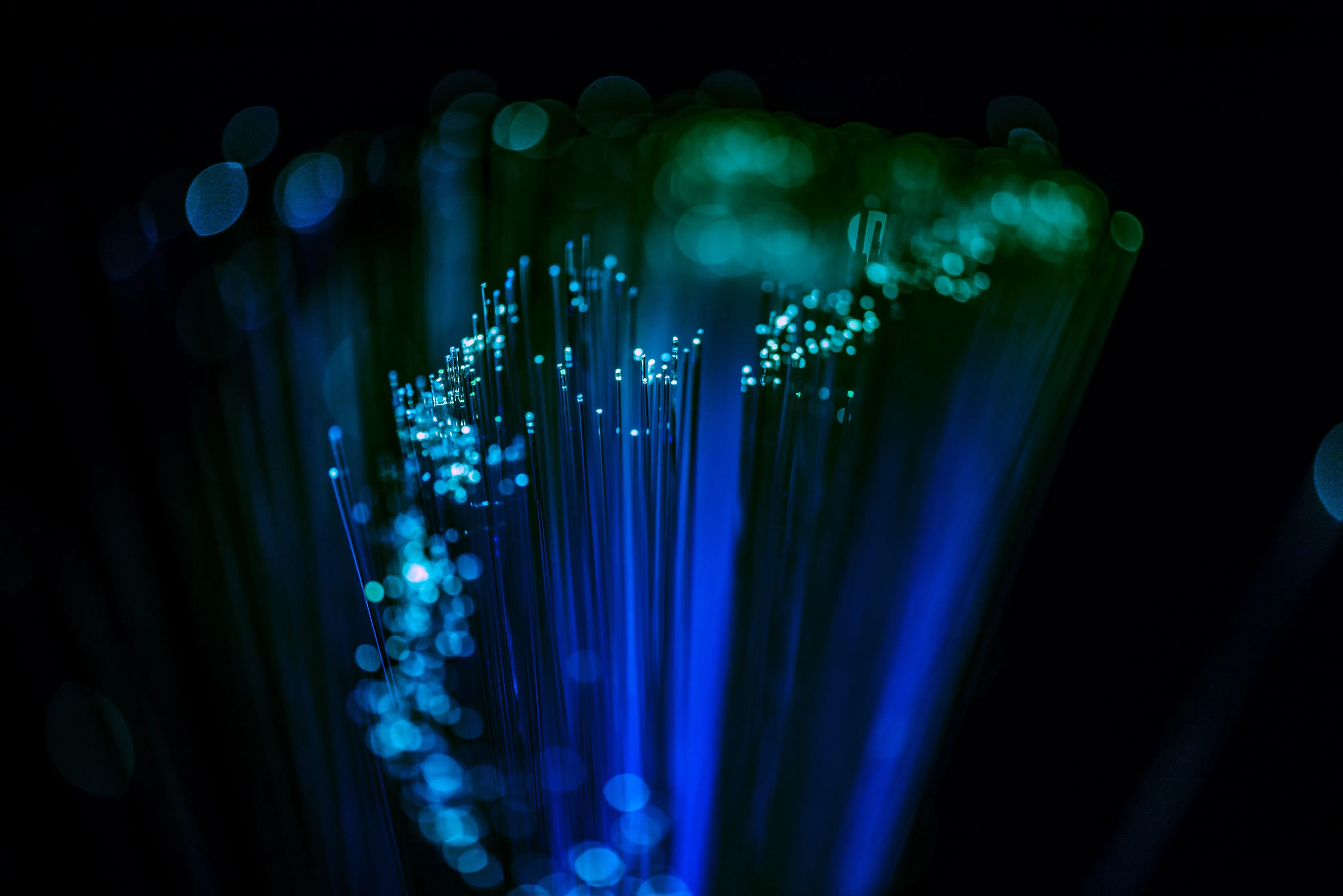 Fiber optic cables glowing in the dark