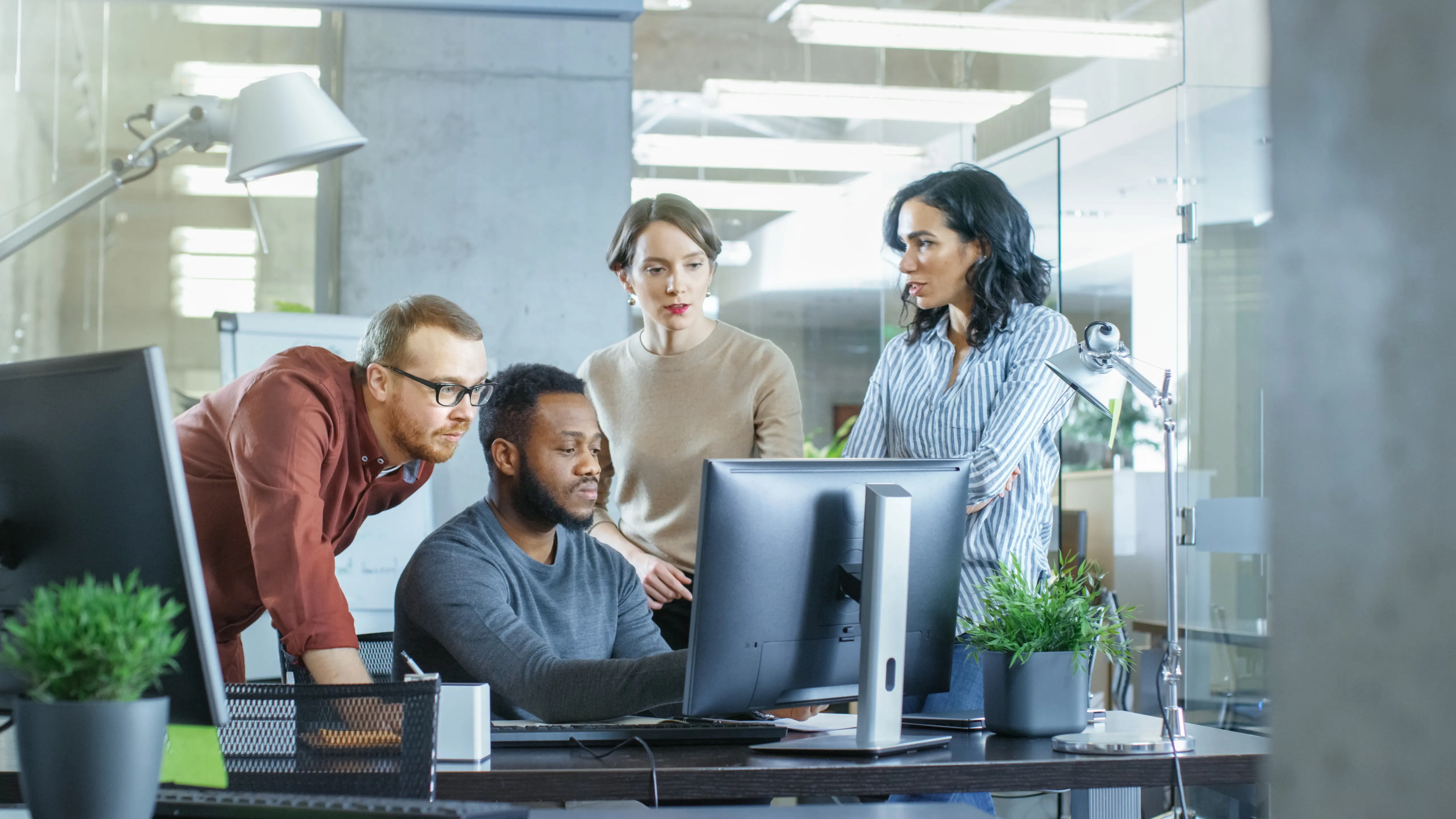 A team working at their workstations