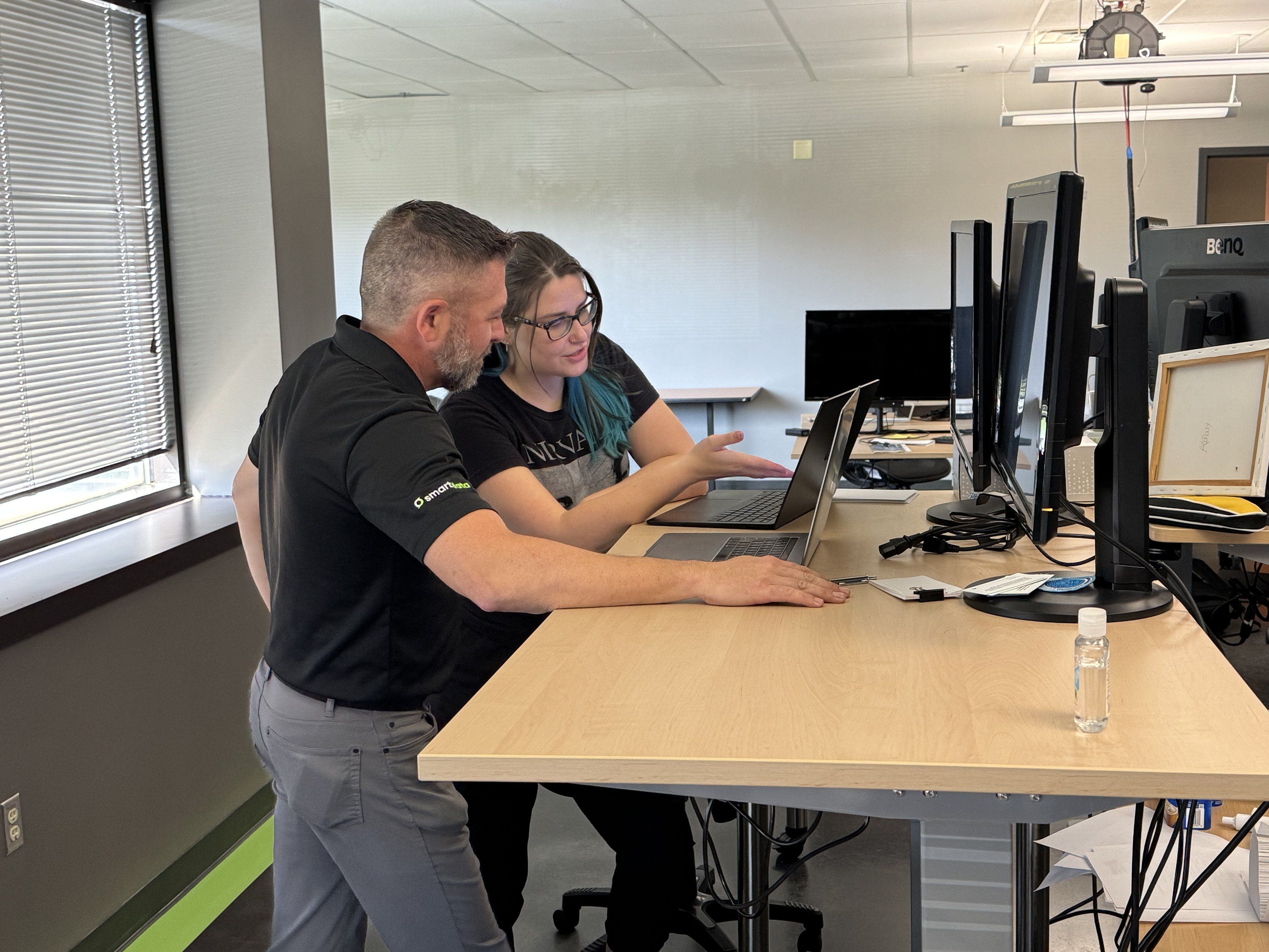 Engineers working together at their computers